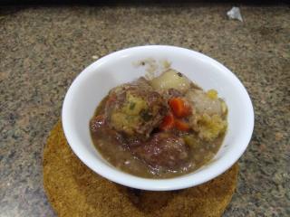 Bowl of Beef Pot Roast Bowl of pot roast with gravy and dumpling