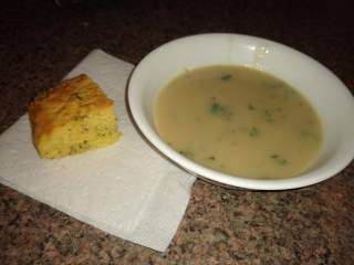Potato and Garlic Soup with Lembas Cornbread next to a bowl of pale brown creamy soup