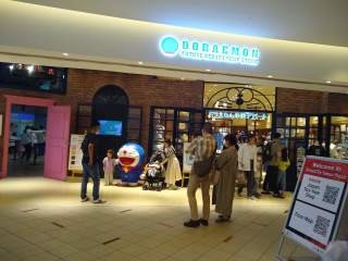 Doraemon Future Department Store (and current themed store) Doraemon store, labeled Doraemon Future Department Store. Very busy, very full of families.