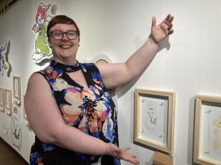 Behold, a drawing! Thia gesturing to show off her manga-style drawing