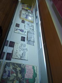 Evil Cat Manga exhibit, part 2 A sideways view of more of the Evil Cat exhibits, featuring woodcuts and old paintings.